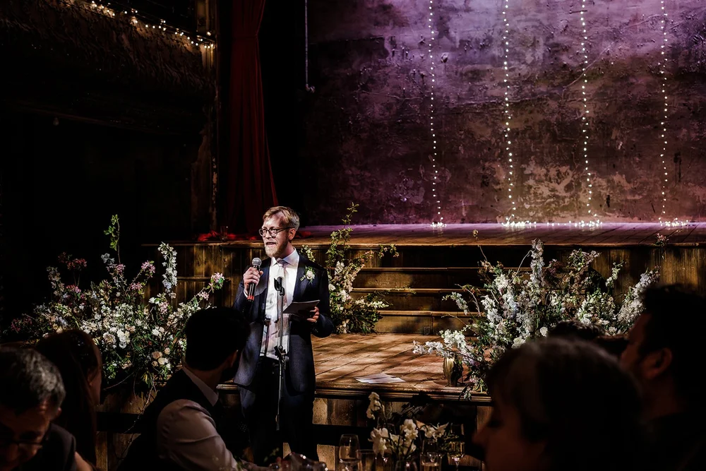 A guest speaking to the room in the hall at Wilton&rsquo;s Music Hall