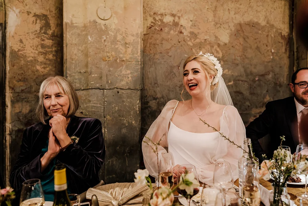 Meg laughing at the top table during the speeches at Wilton&rsquo;s Music Hall