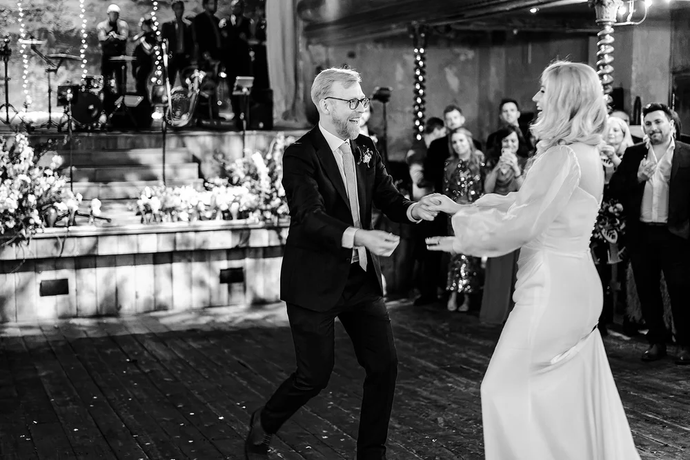 Black and white photograph of Meg and Jamie in the mahogany bar at Wilton&rsquo;s Music Hall