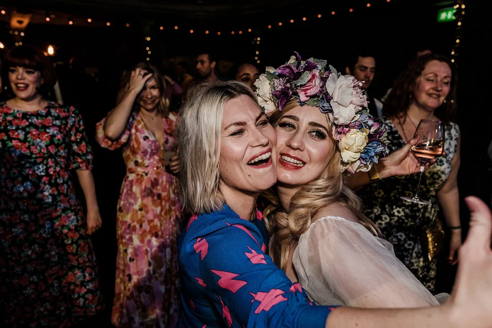 Guests celebrating together at Meg and Jamie&rsquo;s East London wedding