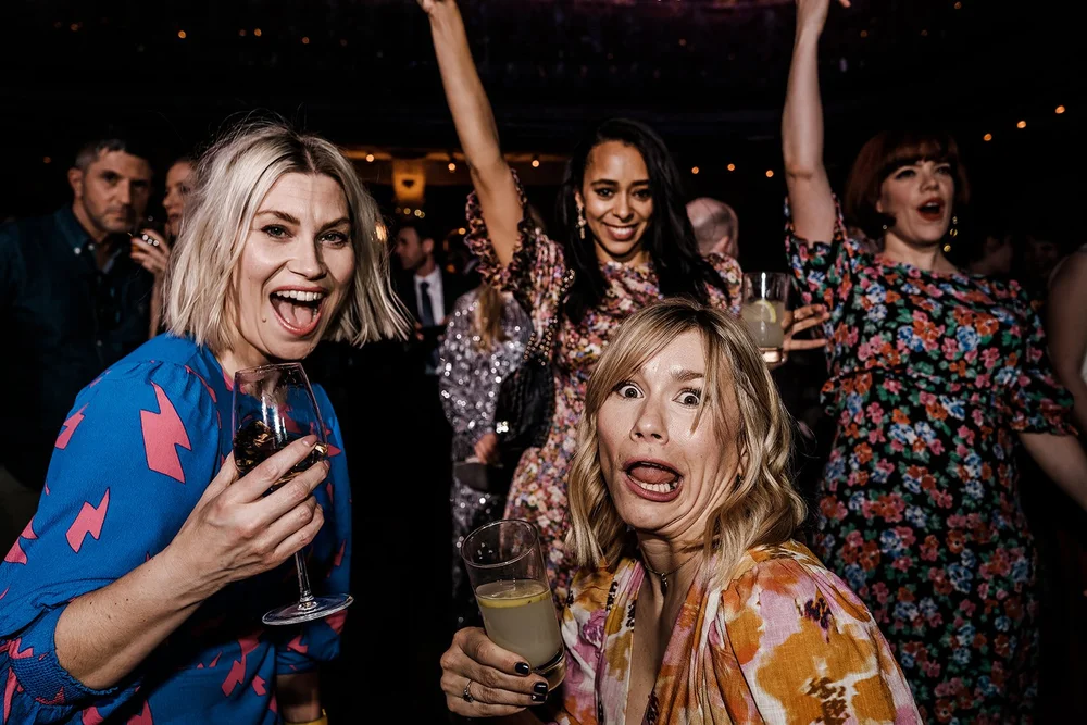Guests laughing on the dance floor late in the evening at Wilton&rsquo;s Music Hall