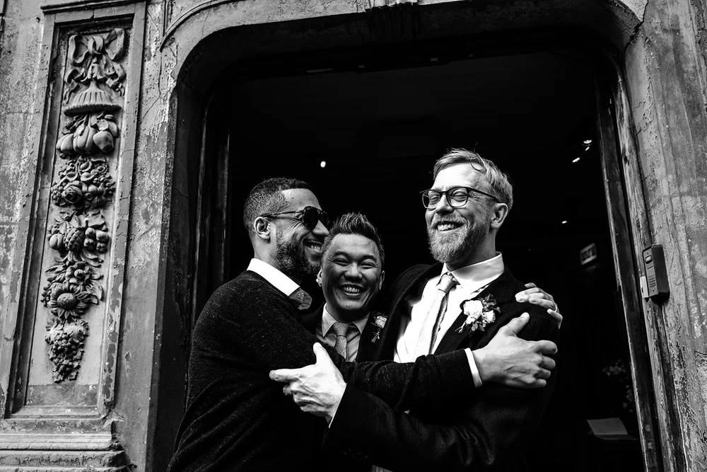 Jamie with friends in the doorway of the old hall at Wilton&rsquo;s Music Hall