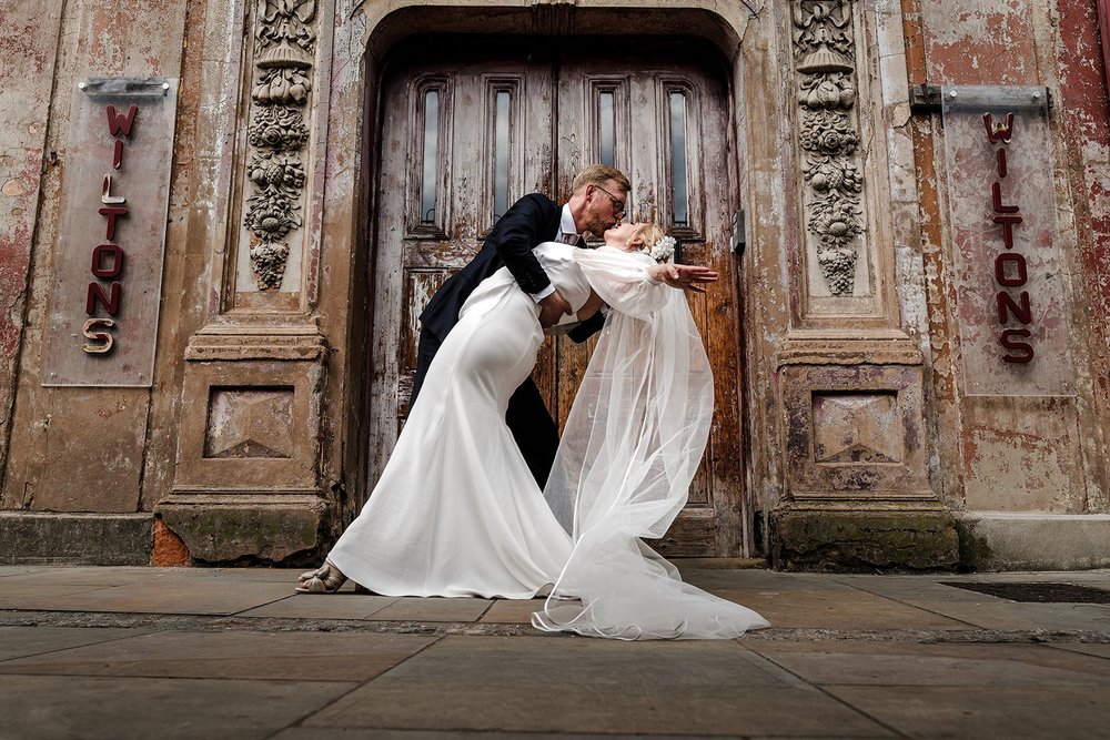 Meg and Jamie dancing outside the doors of Wilton&rsquo;s Music Hall
