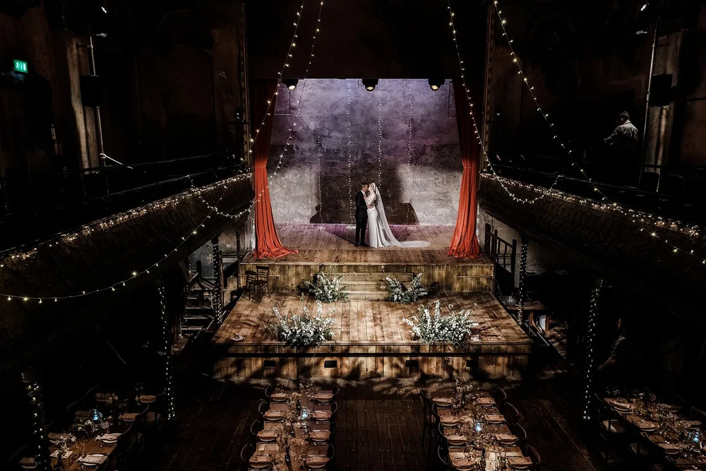 The empty stage and fairy lights at Wilton&rsquo;s Music Hall at the end of the wedding