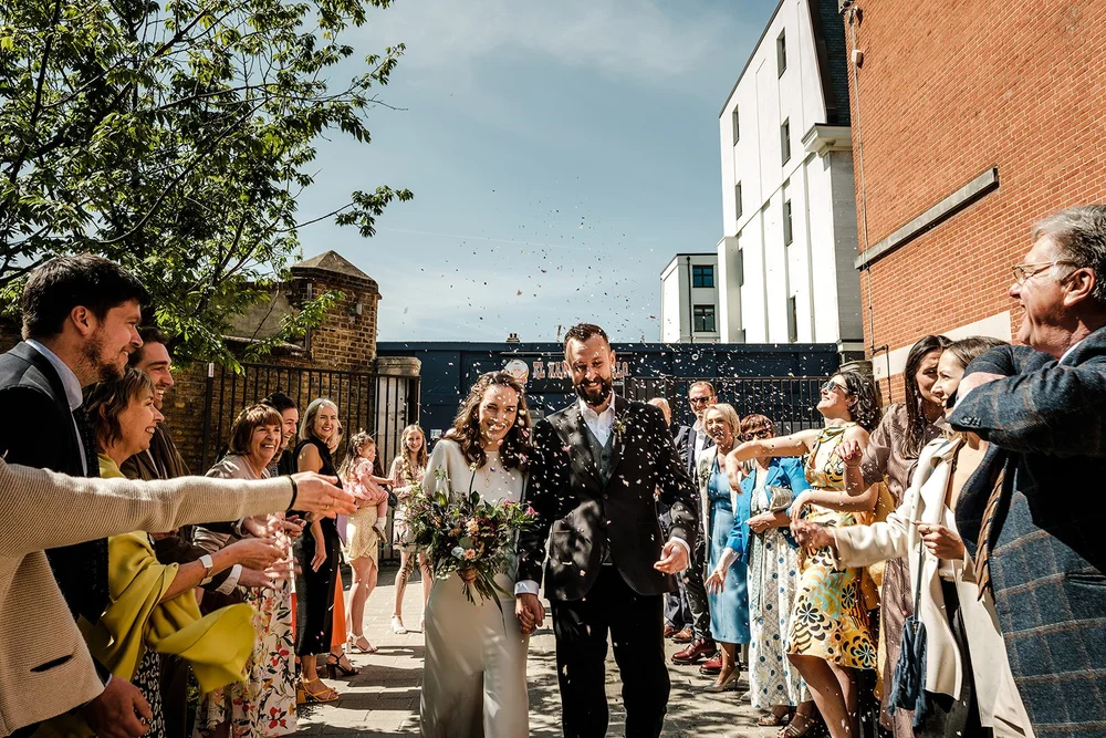 Confetti thrown over Aidan and Charlotte outside Lambeth Town Hall