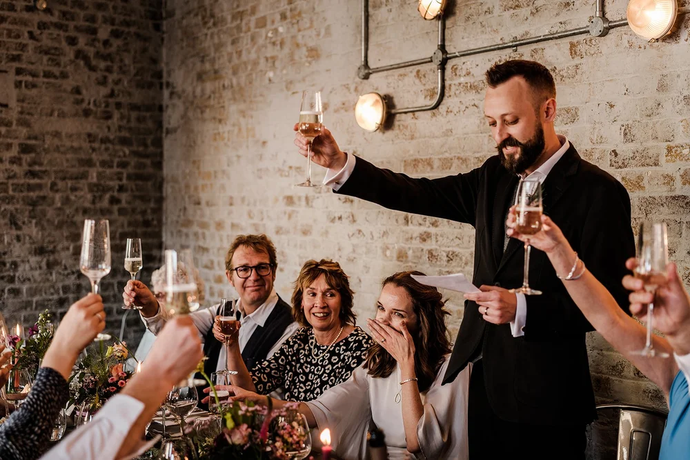 Aidan raising a glass during the toasts at The Workshop at the Half Moon