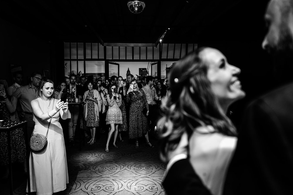 Black and white photograph of Charlotte laughing during the evening
