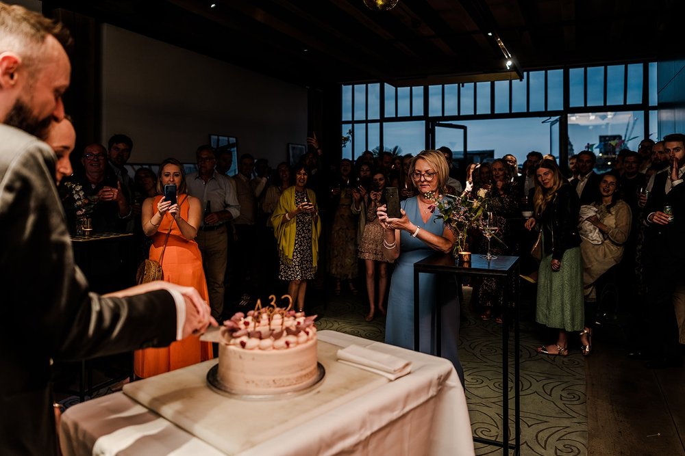 The wedding cake on the table during the evening celebration
