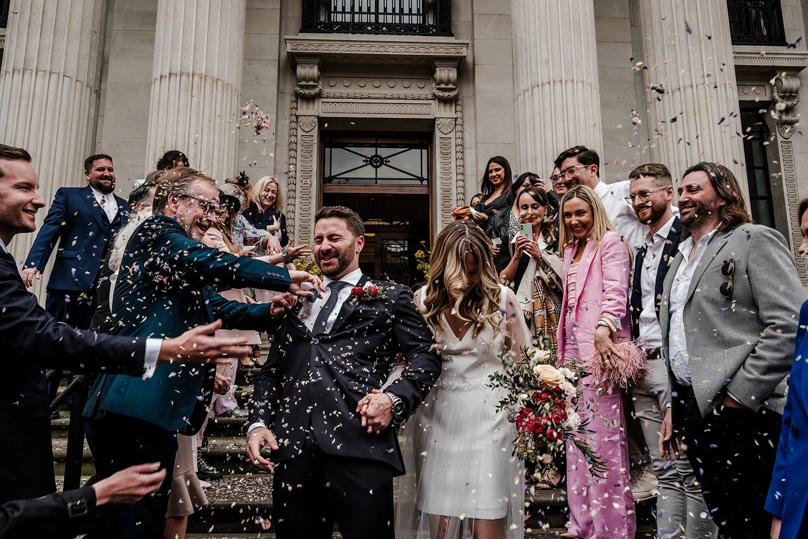 Confetti on the steps of Old Marylebone Town Hall as Nick and Liz leave their ceremony