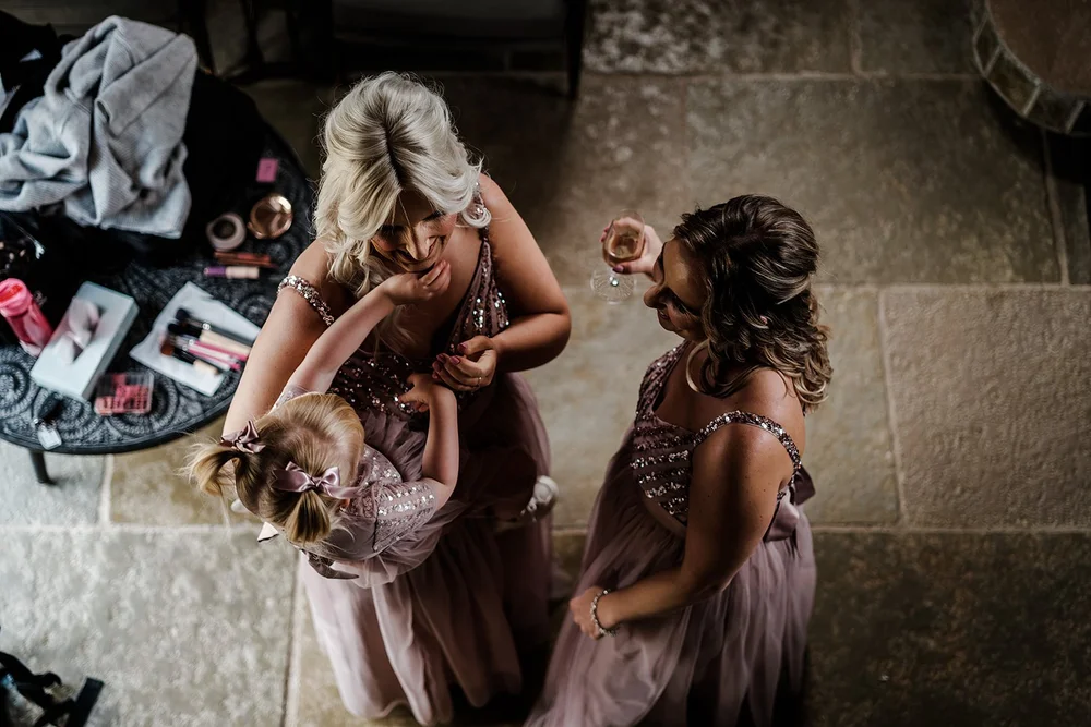 Lauren having her hair finished with her bridesmaids on the morning of the wedding