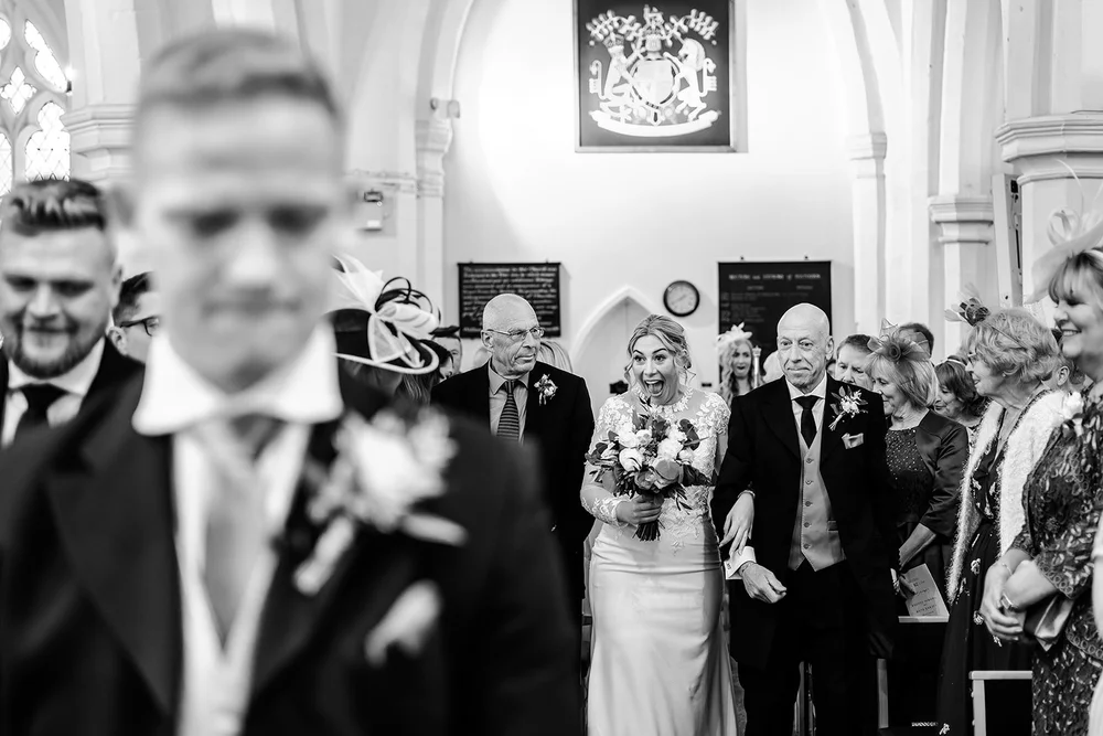 Black and white photograph of Tom watching Lauren walk in