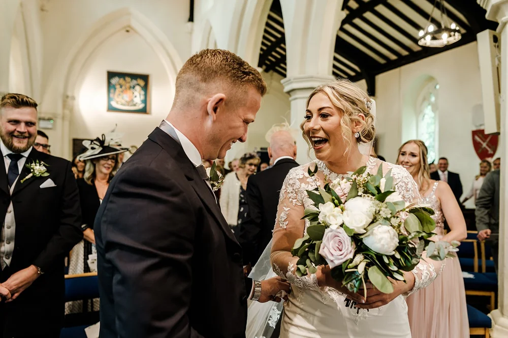Lauren and Tom during their wedding ceremony in Leicestershire