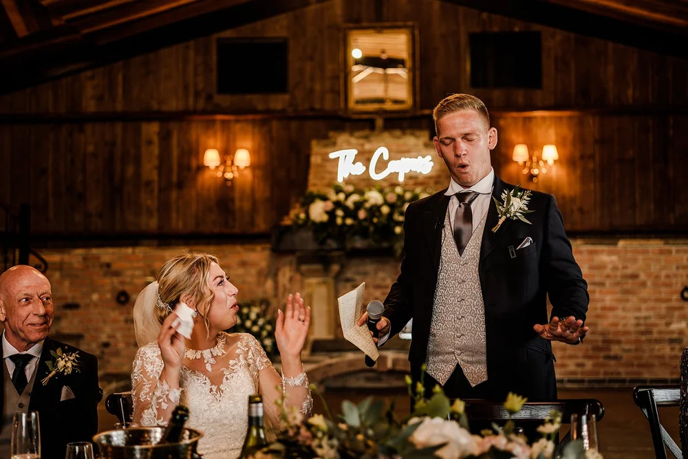 Tom giving his speech beneath the neon sign at Willow Marsh Farm