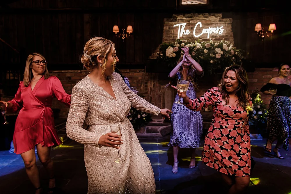 Guests dancing together in the barn at Willow Marsh Farm