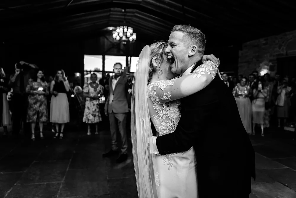 Lauren and Tom dancing with their guests watching at Willow Marsh Farm