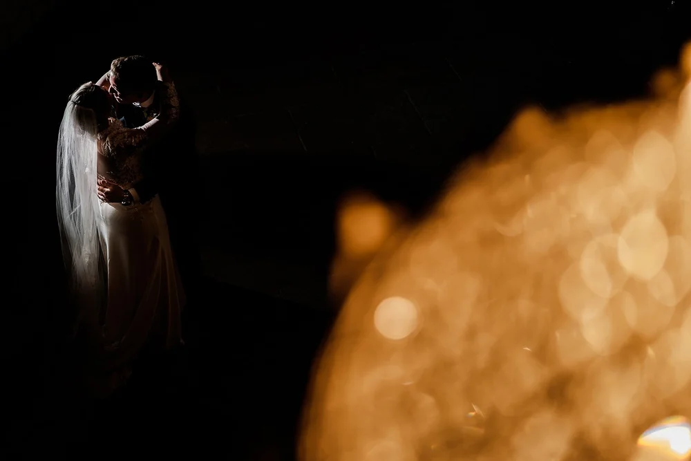 Lauren photographed through candlelight at the end of the evening