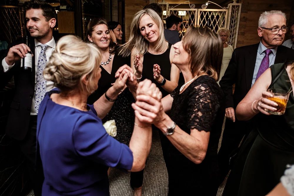 Guests raising glasses together during the reception at Fortnum & Mason