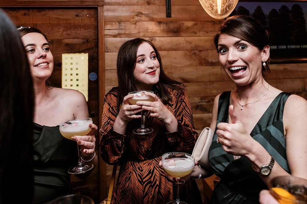 Guests with cocktails at the Fortnum & Mason wedding reception