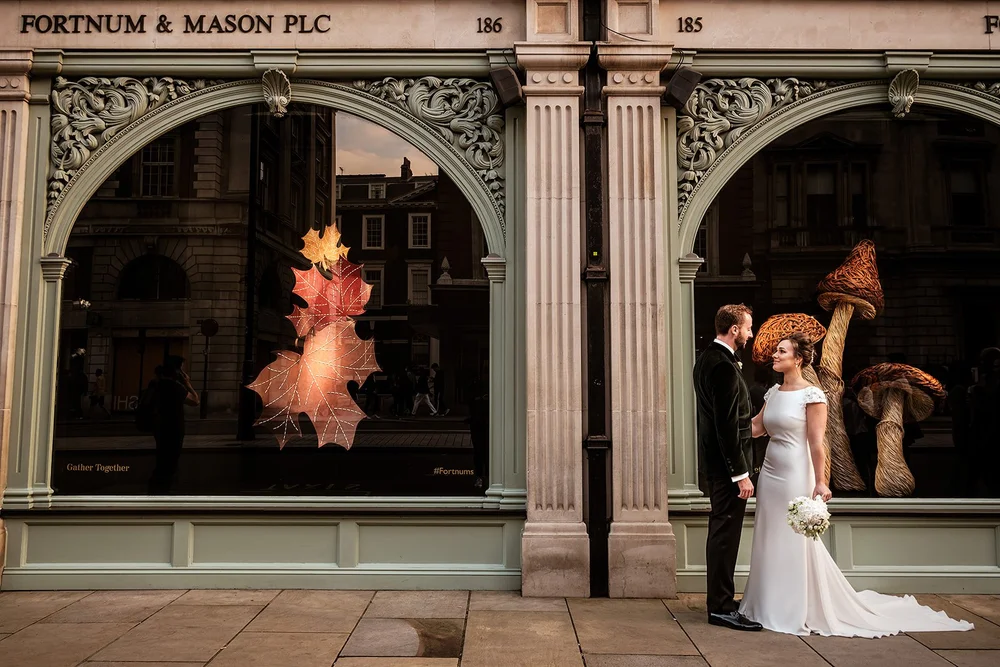 The couple outside the Fortnum and Mason shopfront on Piccadilly
