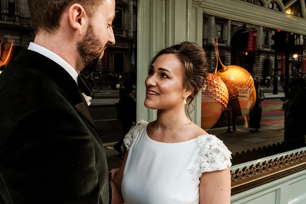 The couple looking at each other outside Fortnum & Mason on Piccadilly