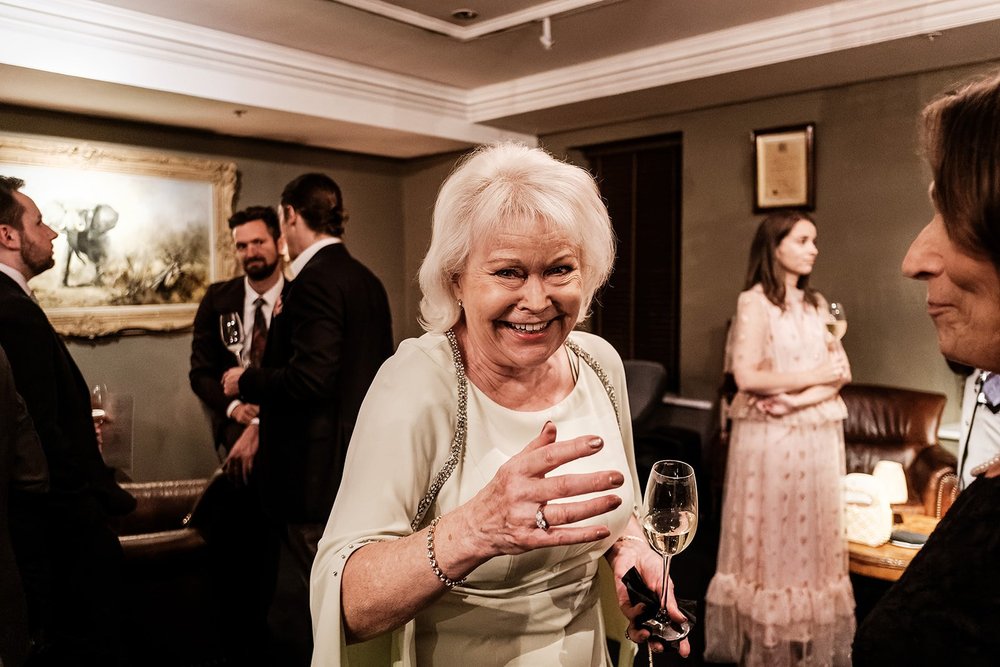 Guests talking during the wedding reception at Fortnum & Mason