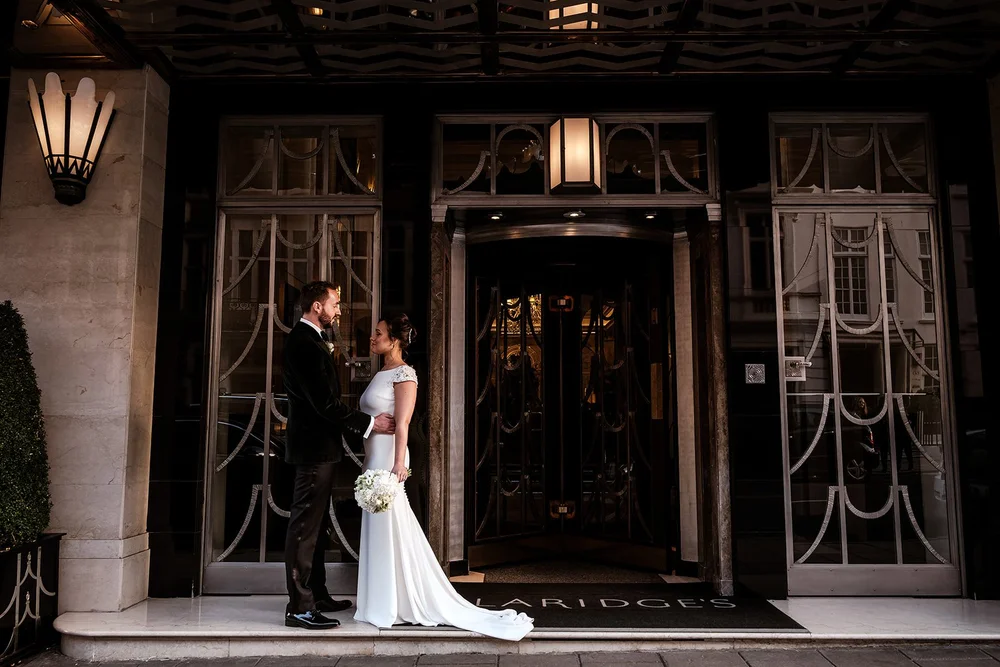 The couple in the doorway at Claridge&rsquo;s in Mayfair before leaving for Fortnum & Mason