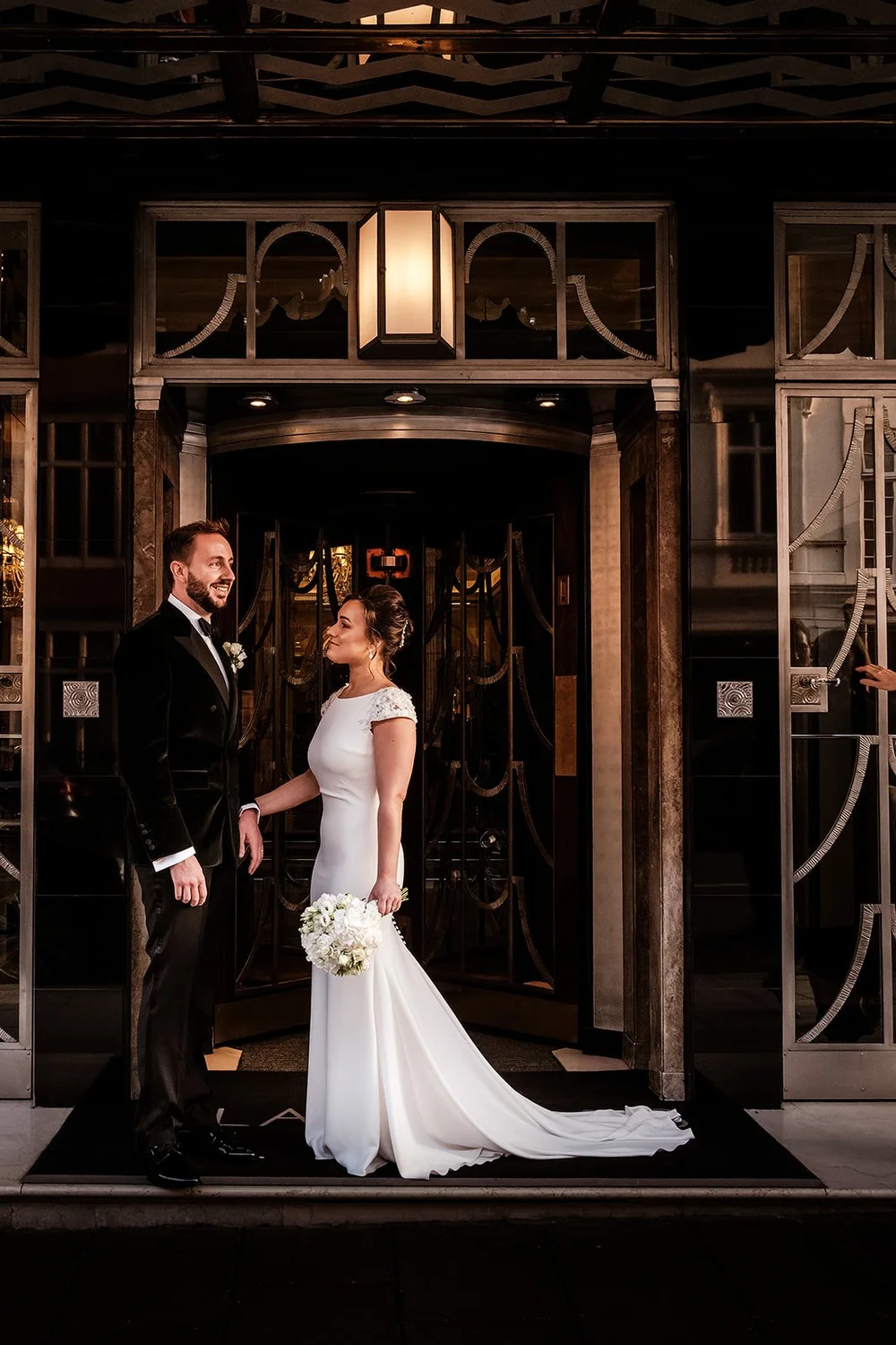 The bride in the art deco doorway at Claridge&rsquo;s