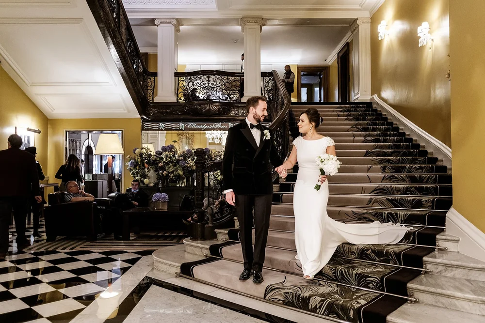 The couple on the chequerboard floor of the lobby at Claridge&rsquo;s