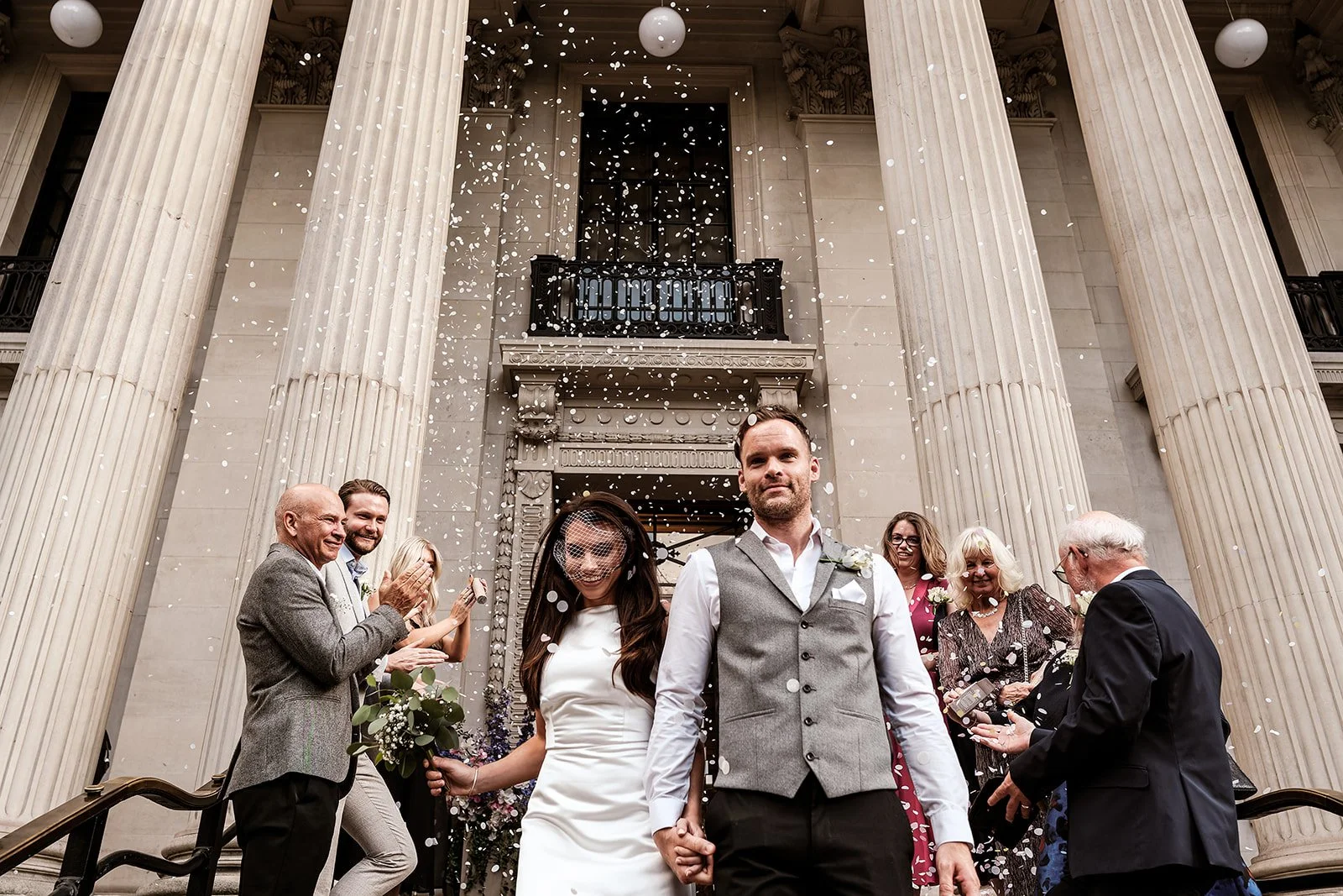 Confetti on the steps of Old Marylebone Town Hall as Gemma and Andy leave their ceremony