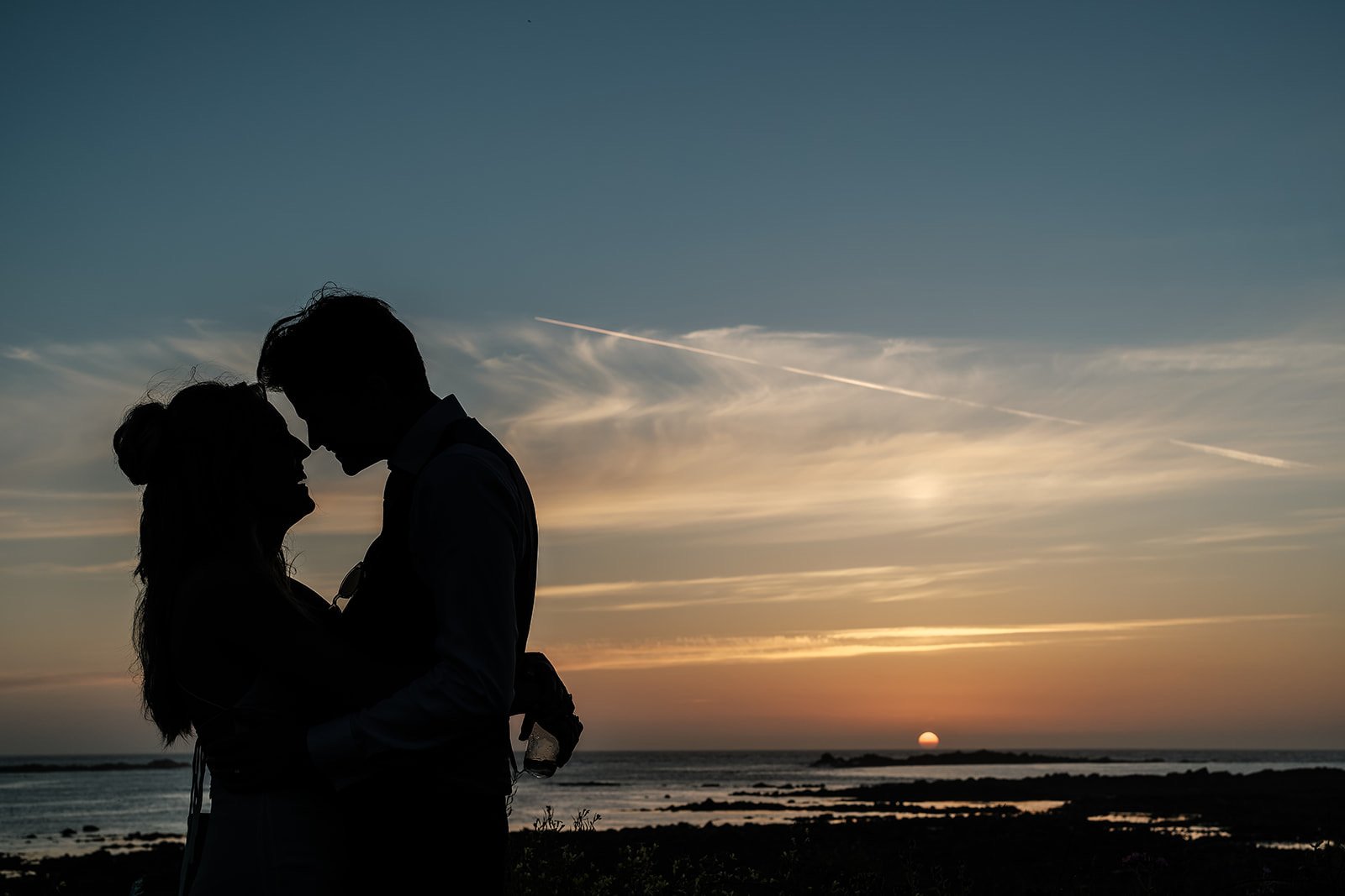 Ellie and George&rsquo;s wedding marquee beside the sea in Guernsey at sunset