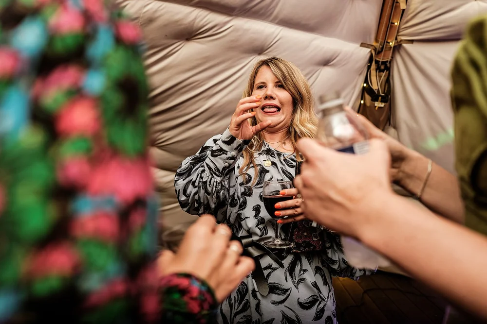 A guest laughing during the evening celebration at Hadsham Farm