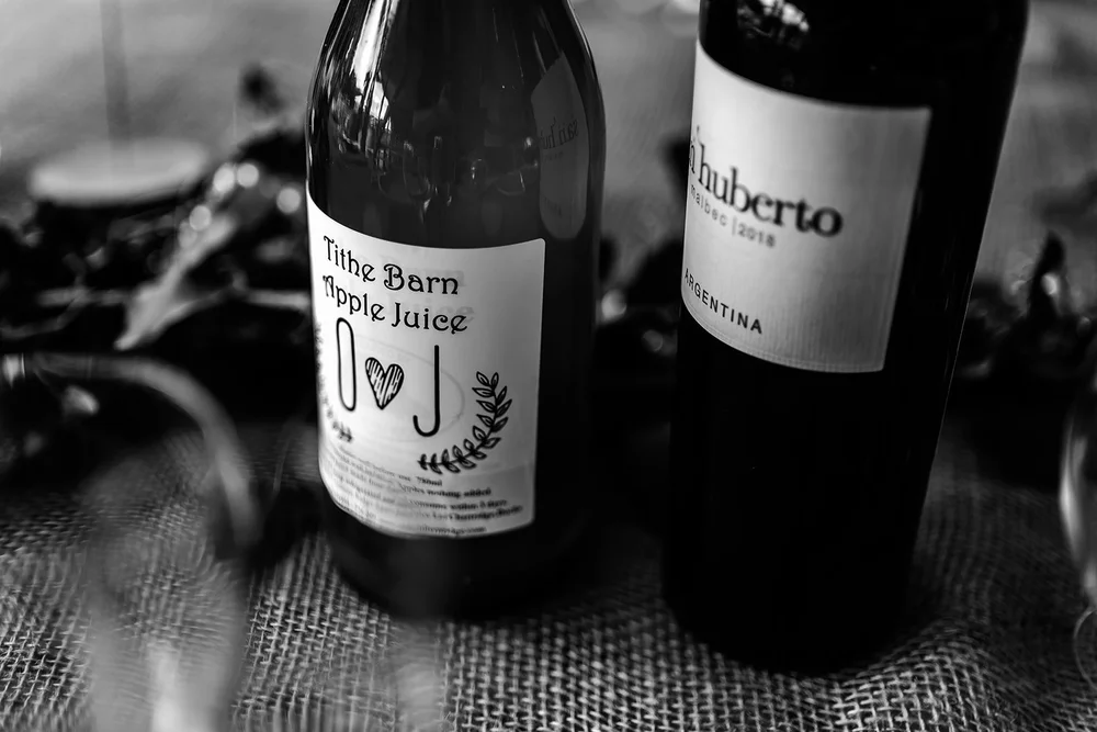 Personalised wine bottles on the table at the Hadsham Farm reception