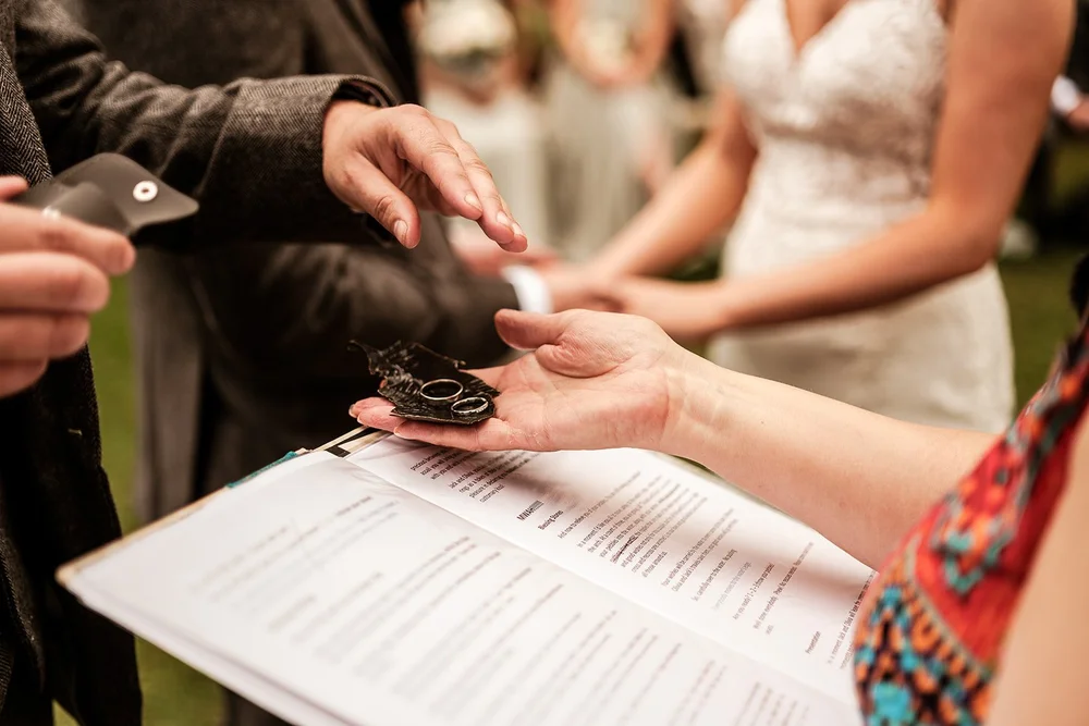 A detail of the rings being exchanged during the ceremony at Hadsham Farm