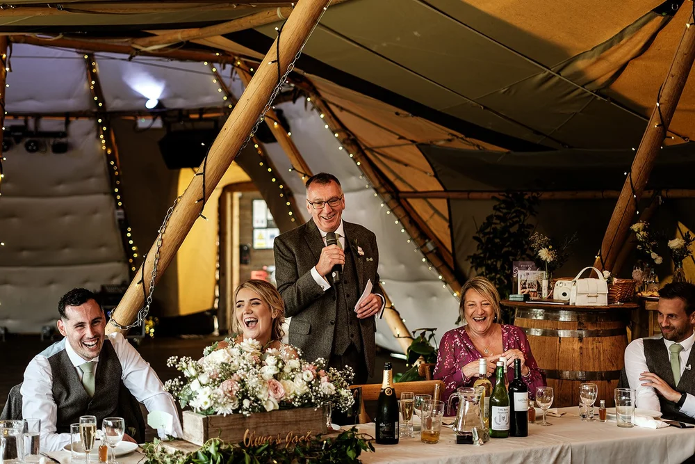 Guests listening to the speeches inside the tipi