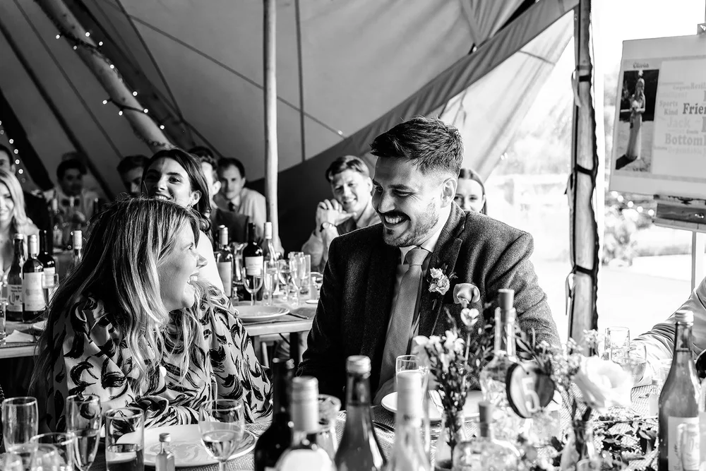 Black and white photograph of the top table during the speeches