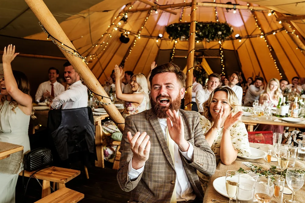 A guest reacting during the wedding speeches at Hadsham Farm
