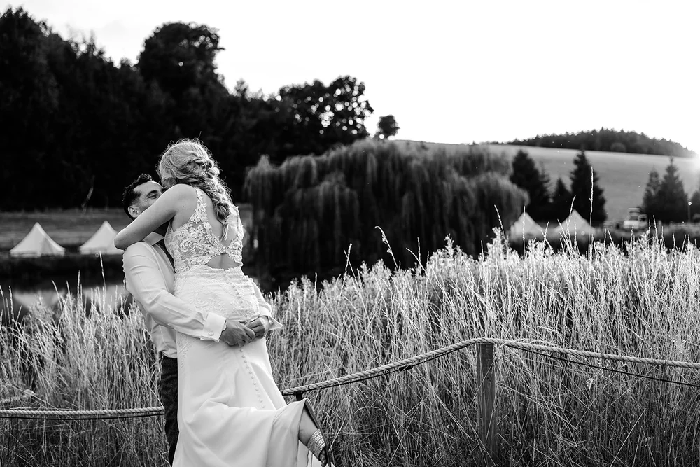 Black and white photograph of Liv in the meadow at Hadsham Farm