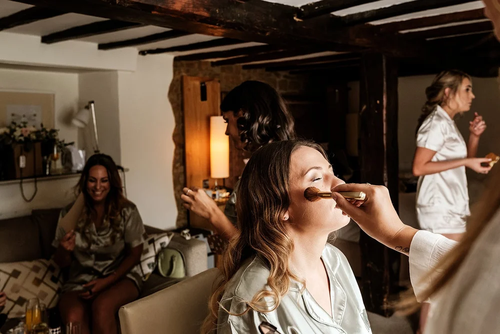 Liv laughing with her bridesmaids during preparations