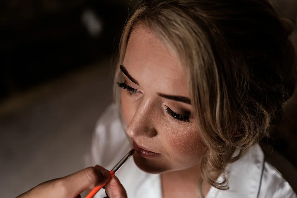 Liv having her make-up finished on the morning of her wedding at Hadsham Farm