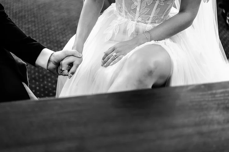 Detail of a wedding dress during a ceremony at Chelsea Old Town Hall