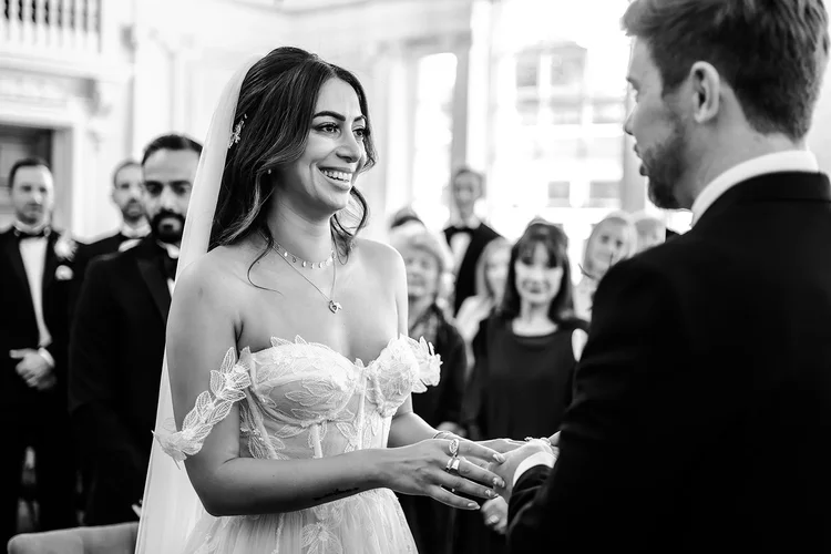 Black and white photograph of a bride and groom during their ceremony at Chelsea Old Town Hall