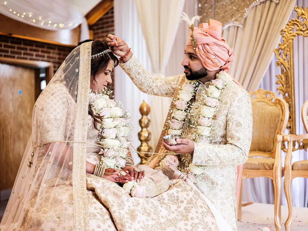 Hindu wedding ceremony in the mandap at Surrey National Golf Club - 5