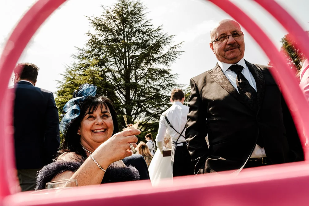 A guest photographed through the ice luge at Farnham Castle