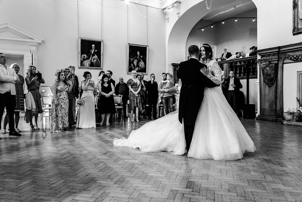 Black and white photograph of Jade and Guy&rsquo;s first dance at Farnham Castle