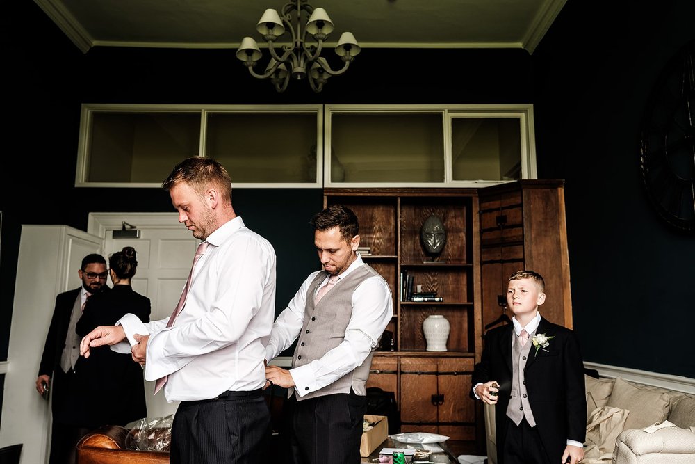 Guy and his groomsmen getting ready before the ceremony at Farnham Castle