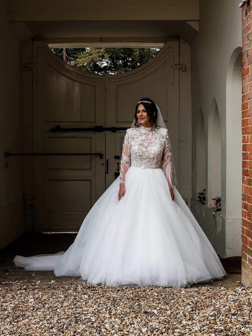Portrait of Jade in her wedding dress before the ceremony at Farnham Castle