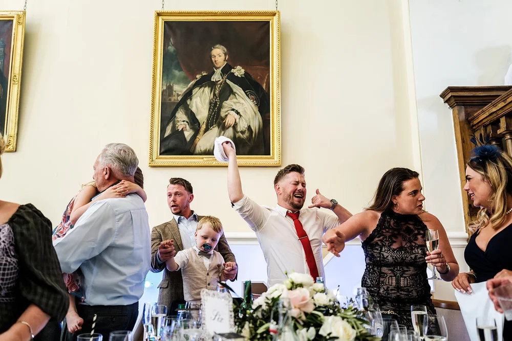 Guests cheering during the speeches at Farnham Castle