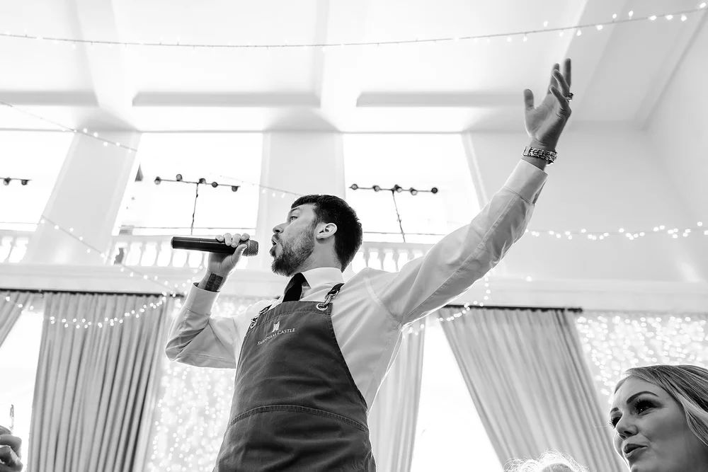 One of the singing waiters performing for the guests at Farnham Castle