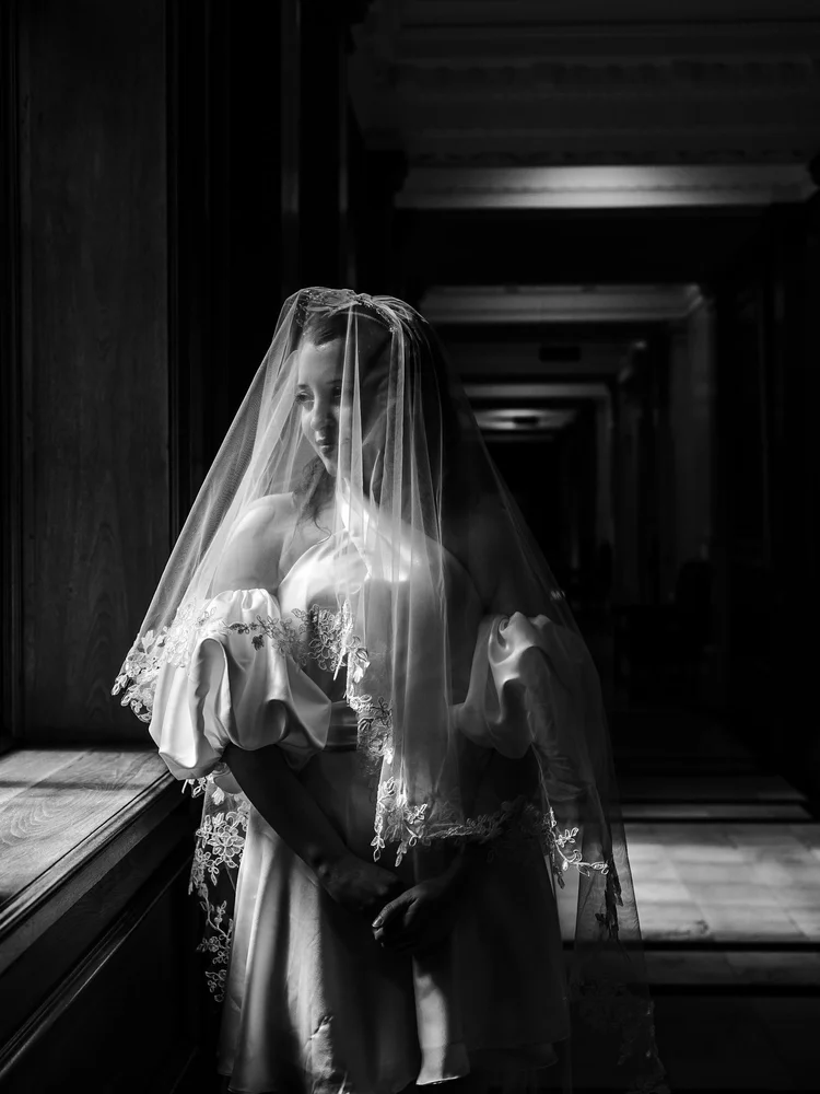 Bride in the doorway at Marylebone Town Hall on her wedding day