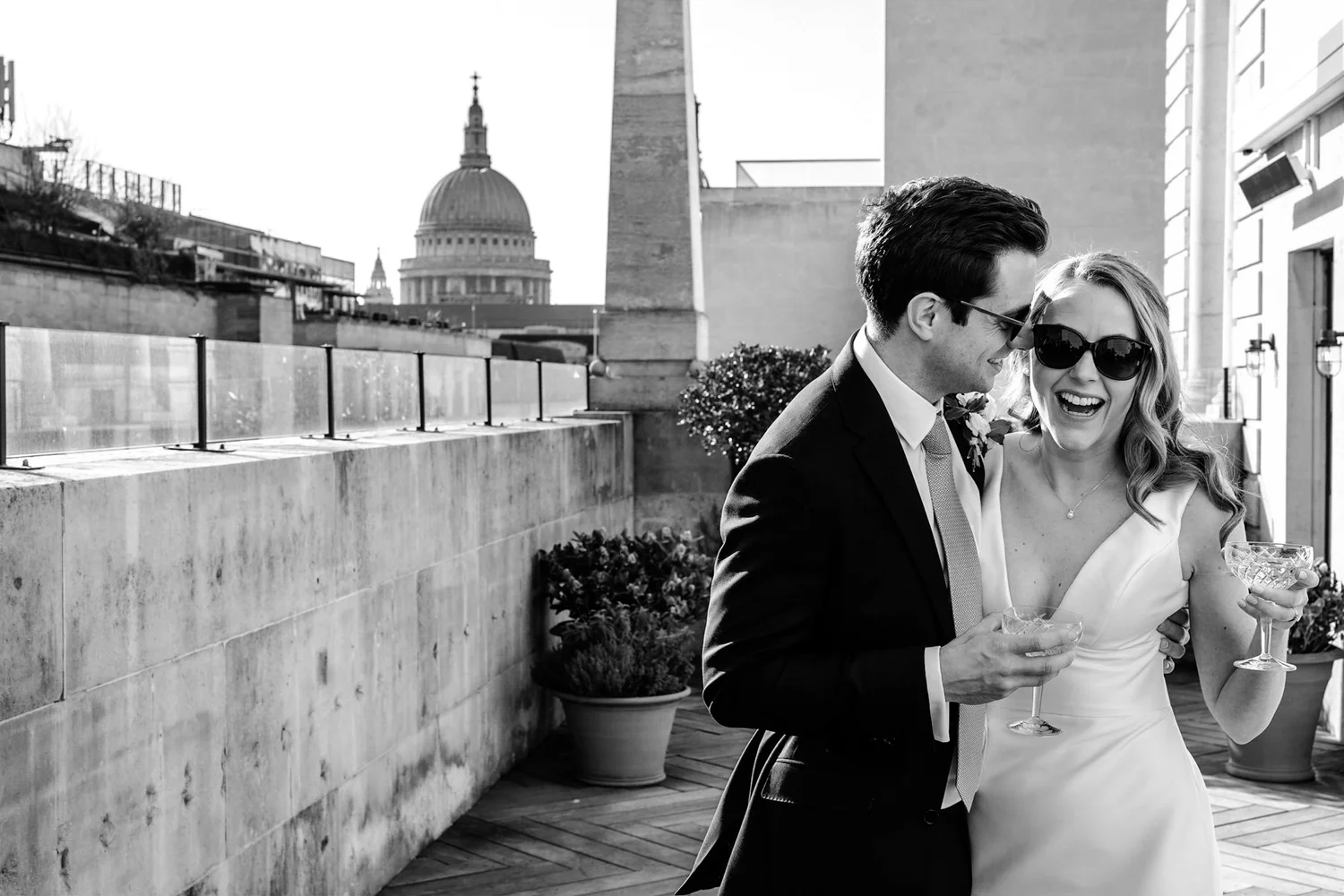 Married couple walking through the grand main banking hall at The Ned Hotel London
